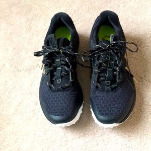 Under Armour baseball cleats.